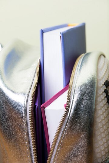 close-up-backpack-with-several-books_23-2147615112 Introduction to Gucci Wallets: The Appeal of Luxury Fashion and Accessories